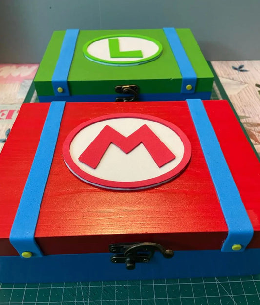 Decorative wooden Mario and Luigi storage boxes with colorful handcrafted relief designs and clasp closures.