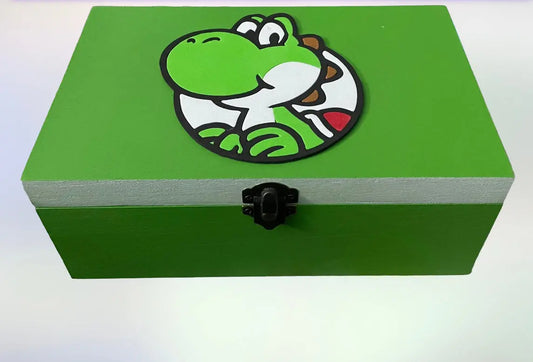 Green wooden Caja Yoshi decorative gaming box with a cartoon Yoshi design on the lid and a black latch closure.